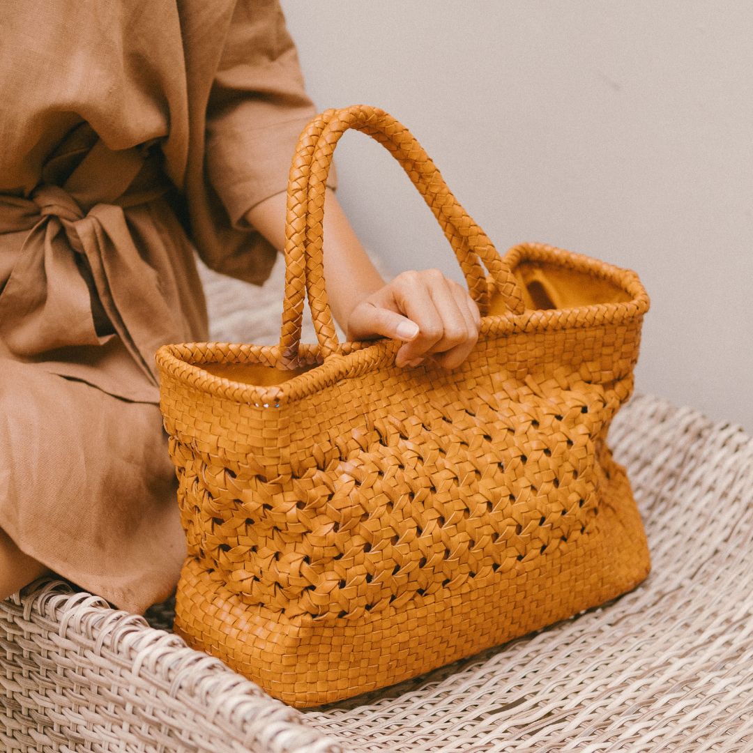 Tan round outlet woven purse