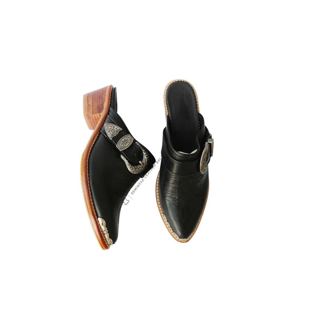 a pair of KARMA cowboy mule heels in black color, the  mule heels is made of genuine sheep leather upper, leather sole, and 5 cm wooden heels